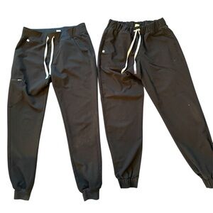 Two pair of Figs black scrub pants. Size Medium Tall